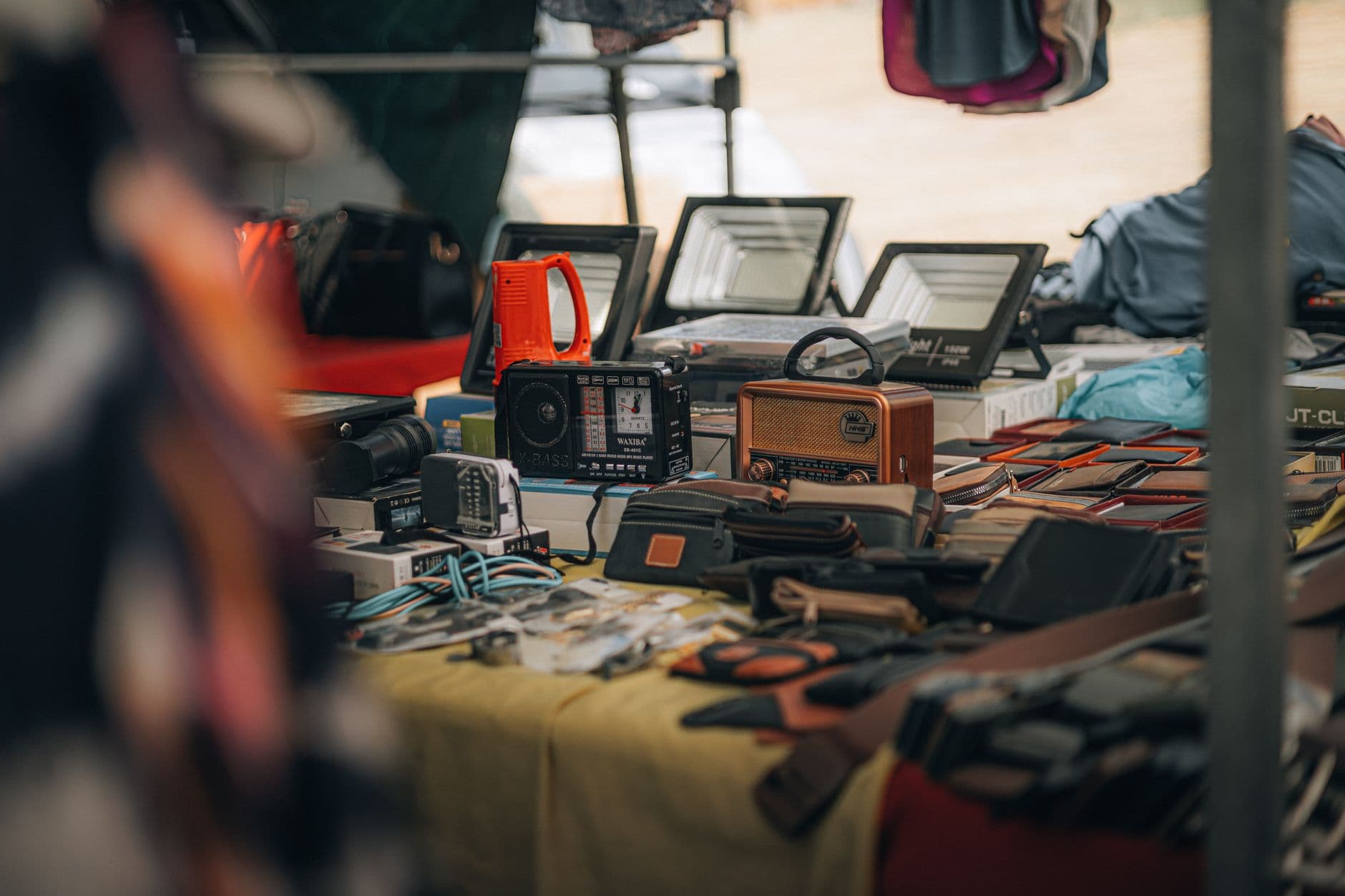 Vintage items and electronics for sale at the Albufeira flea market in the Algarve, Portugal.