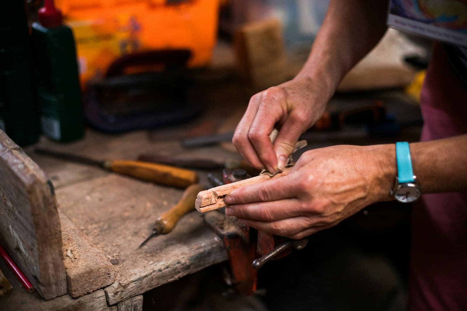 Close-up of hands crafting with natural cork material during a workshop in Faro, Algarve.