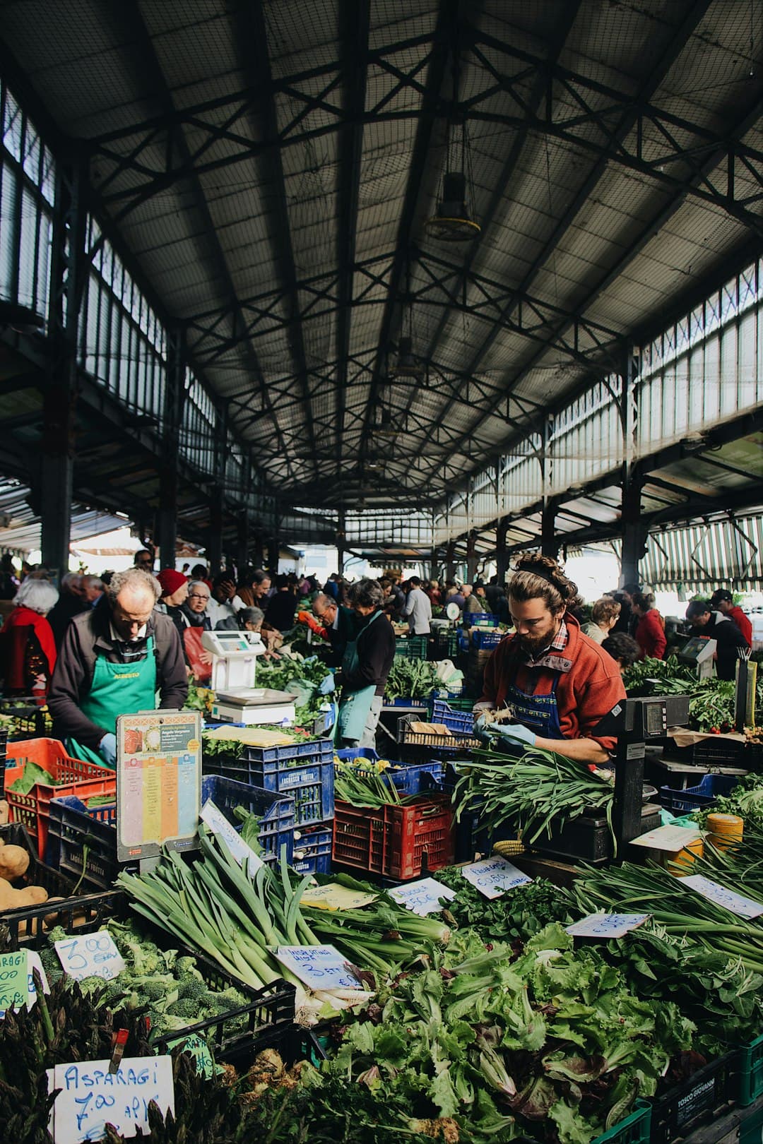 Vendors selling fresh vegetables and produce at the weekly market in São Brás de Alportel, Algarve