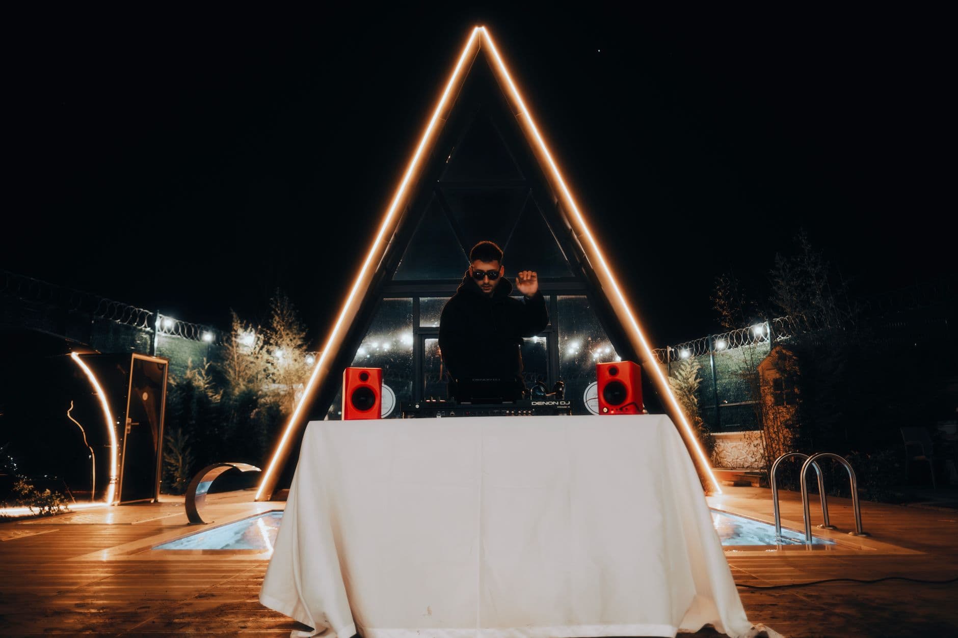 DJ performing live music by the pool at Honorio Club in Vilamoura, Faro, Algarve.