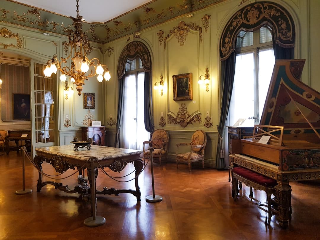 Exquisite period room with ornate harpsichord and antique furnishings at the Municipal Museum in Faro, Algarve.